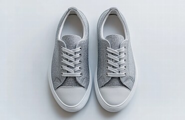 Two silver shoes with glittery laces