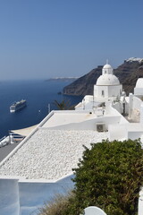 Large luxury cruise ships in the volcano crater of Santorini port seen from above the caldera