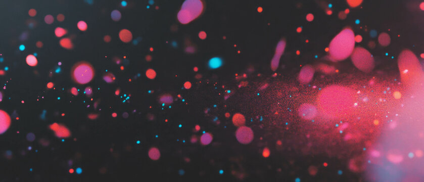 Colorful bubbles merge and separate in dynamic motion against a black background