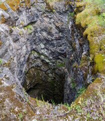 Mysterious depths reveal the hidden stories of an ancient quarry in a tranquil forested locale