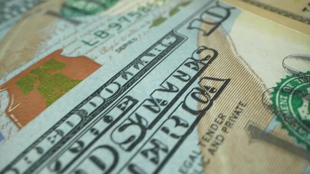 Macro shot of US Dollars. Money Background.Portrait of Benjamin Franklin closeup on the bills for a hundred dollars. Dollars, money close up. 4k footage