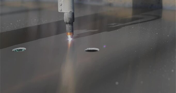 Plasma cutting Plasma cutter work at the factory. The plasma cutter will cut the part. The process of cutting a metal part with a plasma cutter.