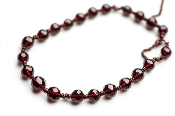 Obraz premium A detailed shot of a decorative necklace featuring bright red beads, suitable for use in jewelry or fashion context