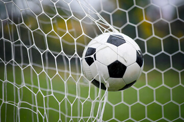 Soccer Ball in a Goal Net, Perfect for Sports Action Photography