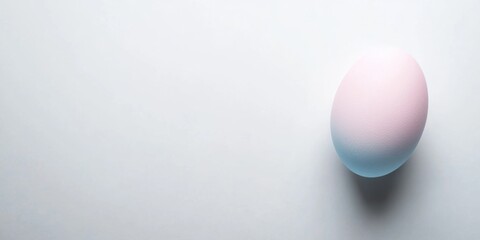Pastel colored egg on white background, easter holiday concept
