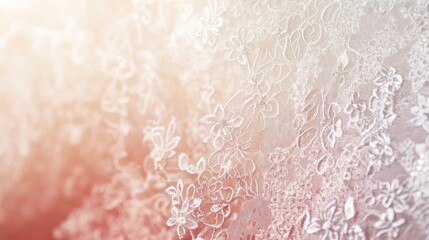 Fototapeta premium Delicate lace fabric adorned with intricate floral patterns illuminated by soft light