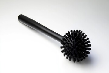 A close-up view of a black brush on a white surface, ideal for use in designs and illustrations