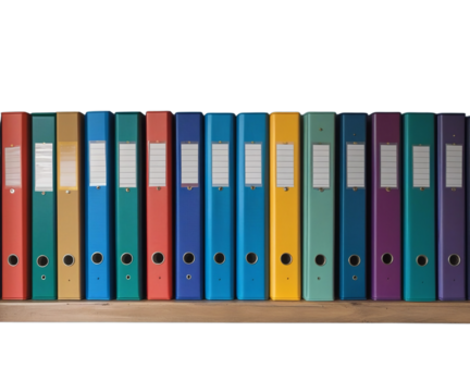a row of colorful binders on a shelf against a blue wall