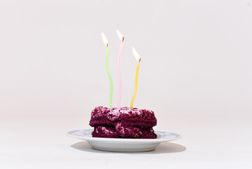 Purple cake with candles on white background, Birthday cake 