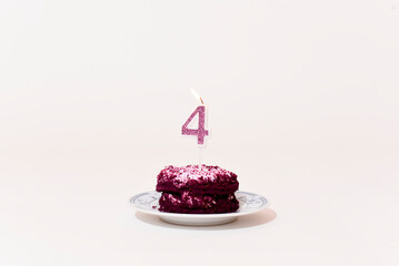 Purple cake with  a candle in shape of number four  on white background, Birthday cake 