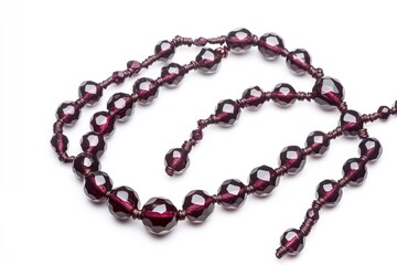 Obraz premium A detailed view of a necklace lying on a clean white surface, ideal for jewelry or product photography