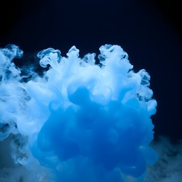 Blue smoke fog against dark background