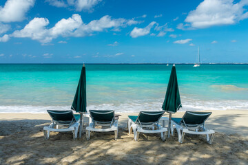 Beach chairs and parasols in Friar's Bay beach, Caribbean dream and landscape, Saint Martin (Sint...
