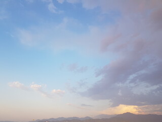 Pastel colour sky, dawn background. Blue sky with clouds and sun light