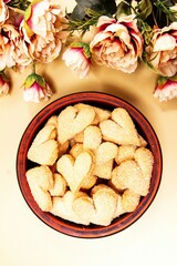 Cookies hearts and flowers on a beige background