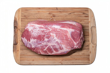 Raw, uncut fresh pork neck meat on a wooden cutting board set on a white background. Top view, no people