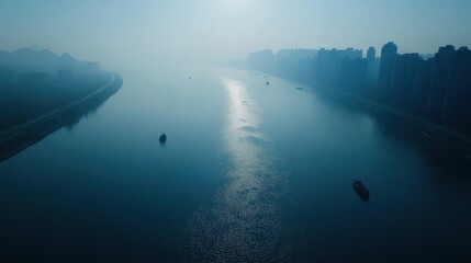 Fototapeta premium A river with boats floating on it and a city in the background