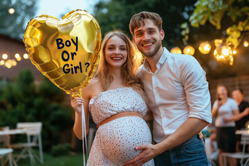 Expecting couple celebrating gender reveal party outdoors, holding a golden heart-shaped balloon with “Boy or Girl?” written, festive atmosphere with string lights and guests in the background.
