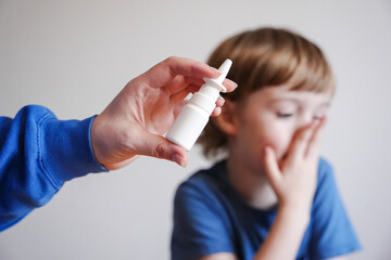 boy in blue t-shirt is sad and sick does not want and is afraid to be treated. does not want to...