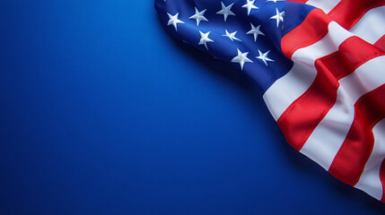 US flag lying on dark blue studio background with copy text
