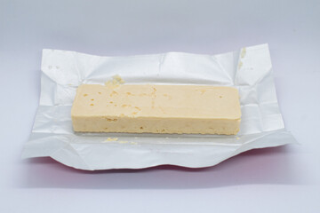 white chocolate bar filled with crispy wafers isolated on white background