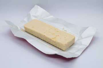 white chocolate bar filled with crispy wafers isolated on white background