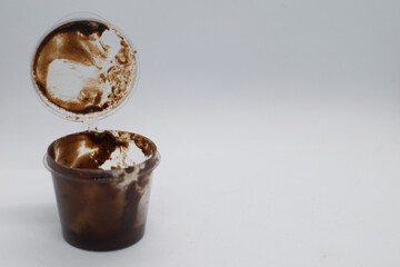 Chocolate in plastic cup container.White background