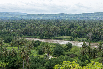 Obraz premium East Sumba, East Nusa Tenggara, Indonesia – 02. 24. 2024 – Heavy rain for two consecutive nights in East Sumba has caused a major flood in the Kambaniru River, with the community on alert 