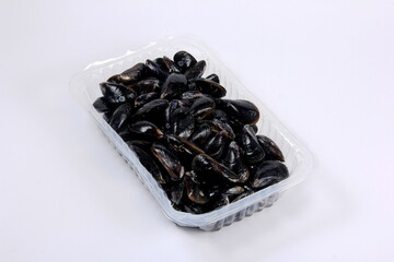 fresh mussel isolated on white background. Fresh mussels in a plastic box