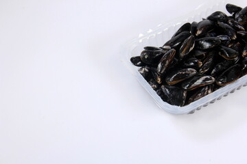 fresh mussel isolated on white background. Fresh mussels in a plastic box