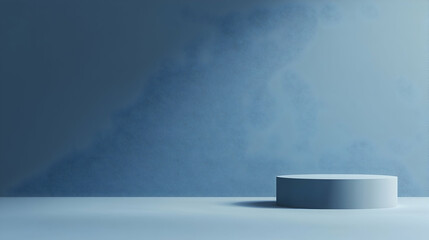 Blue studio backdrop, cylindrical podium, product display