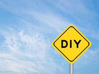 Yellow transportation sign with word DIY (abbreviation of do it yourself) on blue color sky background