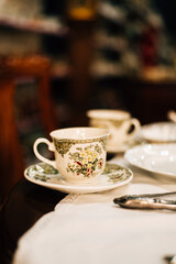 Fototapeta premium vintage cups and saucers on the table
