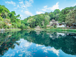 Fototapeta premium Reflections of ancient buildings in the mountains of Heshun Ancient Town, Tengchong, Yunnan