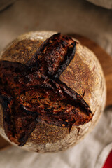 black homemade aromatic bread with a cut