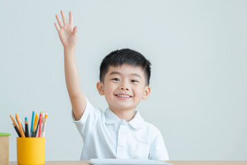 Happy Schoolboy Raising Hand in Classroom – Education, Learning, and Childhood Development
