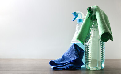Spray bottles with general household cleaning product and microfiber cloths
