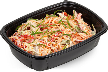 Salad with carrots, peppers and green onions in a black plastic lunchbox photo on a white background