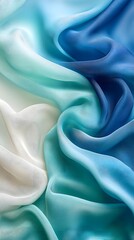 Obraz premium Serene Blue Gradient Silk: Luxurious silk fabric in a captivating ombre gradient, transitioning smoothly from creamy white to deep ocean blue, creating a calming and elegant visual texture.