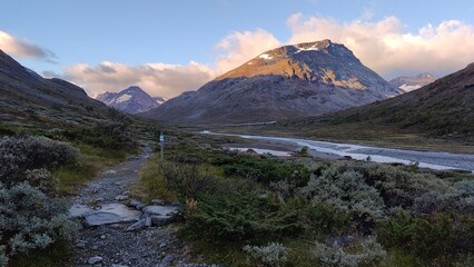 Hiking through beautiful landscapes to Galdhøpiggen in the Jotunheimen Mountain Range in Norway