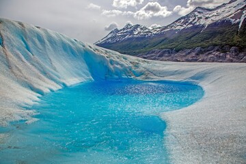 A vibrant meltwater lake on the surface of Grey Glacier in Patagonia