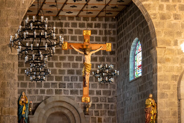 Sculpture of Jesus Christ on the cross inside a church.