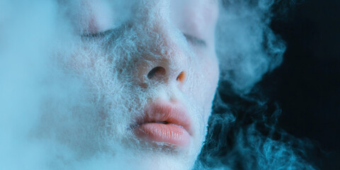Fototapeta premium Human Face Partially Covered by Fibrous Material and Vapor