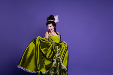 Woman in elegant green dress in front of a vibrant purple backdrop, portraying classic beauty and historical charm with a luxurious touch.