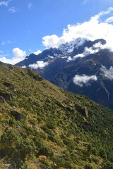 Hiking in the stunning Khumbu Valley surrounded by glaciars and snowy peaks in the Himalayan Everest Base Camp Trek