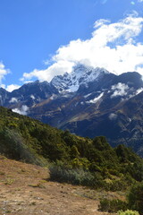 Hiking in the stunning Khumbu Valley surrounded by glaciars and snowy peaks in the Himalayan...