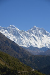 Hiking in the stunning Khumbu Valley surrounded by glaciars and snowy peaks in the Himalayan...