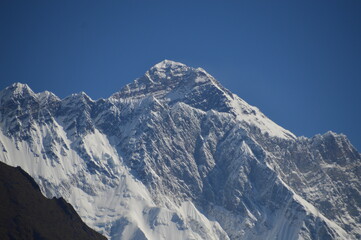 Hiking in the stunning Khumbu Valley surrounded by glaciars and snowy peaks in the Himalayan...