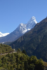 Hiking in the stunning Khumbu Valley surrounded by glaciars and snowy peaks in the Himalayan...