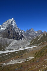 The stunning Himalayan Mountain ranges with snowy  glaciars and breathtaking views of Mount Everest, Ama Dablam and Lhotse while trekking